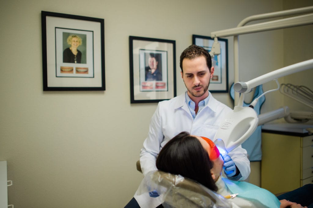 Dr. Tostado providing Zoom! whitening treatment at 5 Star Dental Group.